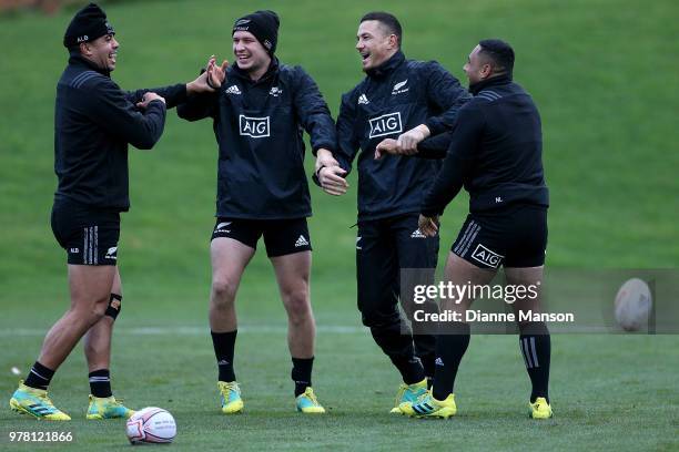 Anton Lienert-Brown, Jack Goodhue, Sonny Bill Williams and Ngani Laumape of the All Blacks warm up during a New Zealand All Blacks training session...