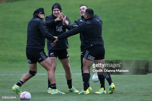 Anton Lienert-Brown, Jack Goodhue, Sonny Bill Williams and Ngani Laumape of the All Blacks warm up during a New Zealand All Blacks training session...