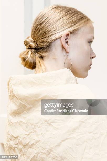 Model, hair detail, is seen backstage ahead of the Aalto show during Milan Men's Fashion Week Spring/Summer 2019 on June 18, 2018 in Milan, Italy.