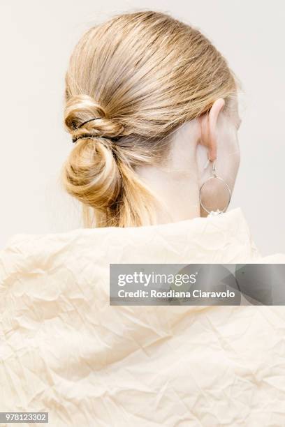 Model, hair detail, is seen backstage ahead of the Aalto show during Milan Men's Fashion Week Spring/Summer 2019 on June 18, 2018 in Milan, Italy.