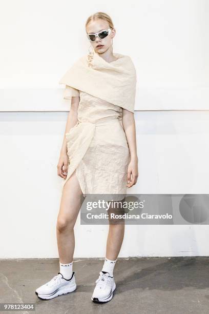 Model is seen backstage ahead of the Aalto show during Milan Men's Fashion Week Spring/Summer 2019 on June 18, 2018 in Milan, Italy.