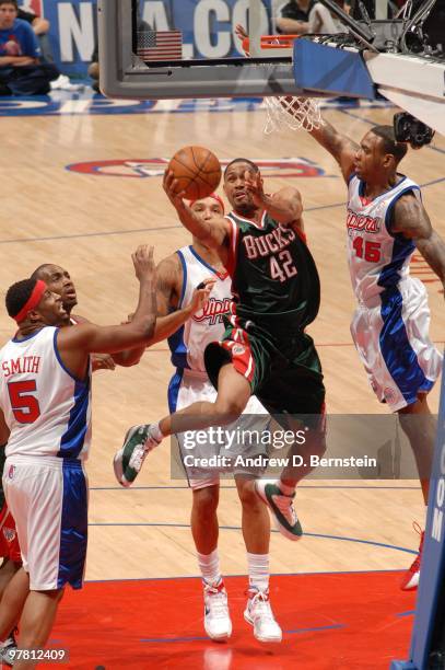 Charlie Bell of the Milwaukee Bucks attempts a shot against Rasual Butler of the Los Angeles Clippers at Staples Center on March 17, 2010 in Los...