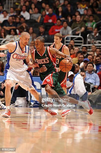 Brandon Jennings of the Milwaukee Bucks drives against Steve Blake of the Los Angeles Clippers at Staples Center on March 17, 2010 in Los Angeles,...