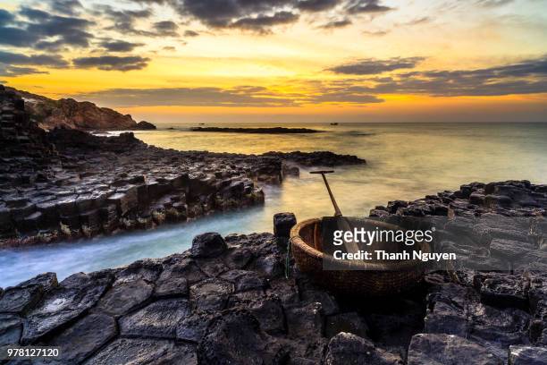 wooden basket on rocky beach, phu yen province, vietnam - phu yen province stock pictures, royalty-free photos & images