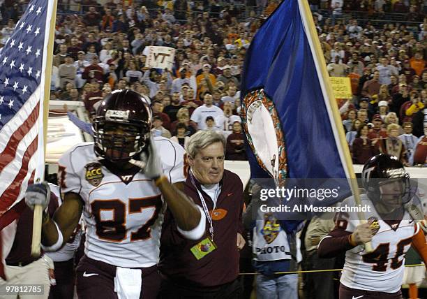 Virginia Tech coach Frank Beamer dashes to the field before play at the 2005 ACC Football Championship Game in Jacksonville.