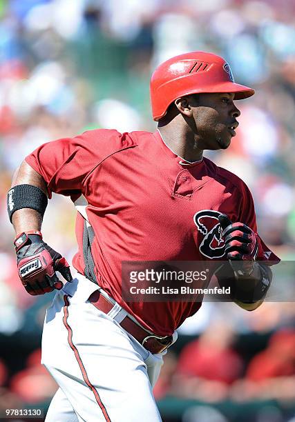 Justin Upton of the Arizona Diamondbacks runs to first base during a Spring Training game against the Los Angeles Angels of Anaheim on March 17, 2010...
