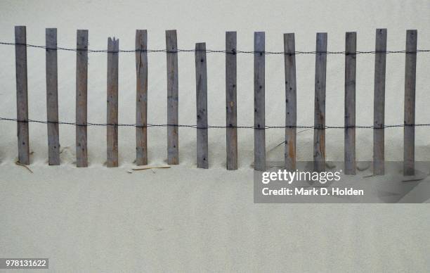 wire fence in sand, cape cod, massachusetts, usa - beach fence stock-fotos und bilder