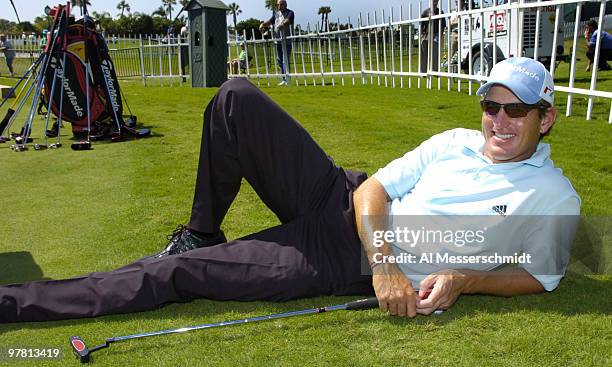 Greg Owen rest near the practice putting green at the 2006 Honda Classic March 7 at the Country Club at Mirasol in Palm Beach Gardens, Florida.