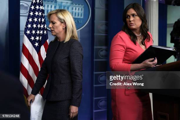 Secretary of Homeland Security Kirstjen Nielsen leaves after she briefed members of the press as White House Press Secretary Sarah Sanders looks on...