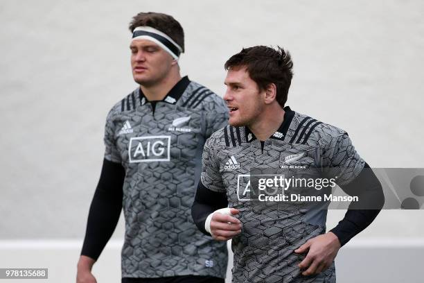 Scott Barrett and Matt Todd of the All Blacks make their way on to the field during a New Zealand All Blacks training session on June 19, 2018 in...