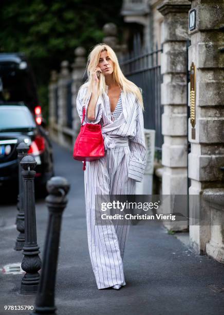 Ada Kokosar wearing striped overall, red bag is seen outside Stella McCartney during Milan Men's Fashion Week Spring/Summer 2019 on June 18, 2018 in...