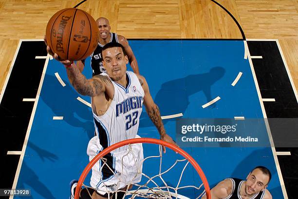 Matt Barnes of the Orlando Magic takes the ball to the basket against the San Antonio Spurs during the game on March 17, 2010 at Amway Arena in...