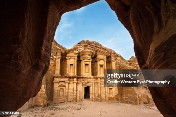 view from cave, petra, nabataean kingdom, jordan - petra jordan stockfoto's en -beelden