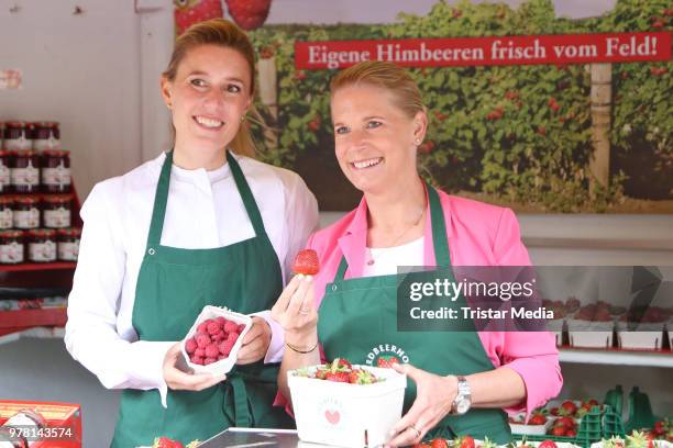 Cornelia Poletto and Janne Meyer-Zimmermann during the charity sale of strawberries and raspberries of Erdbeerhof Glantz for 'Ein Herz für Kinder' at...