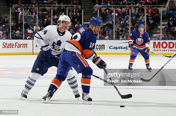 Richard Park of the New York Islanders skates against Mikhail Grabovski of the Toronto Maple Leafs on March 14, 2010 at Nassau Coliseum in Uniondale,...