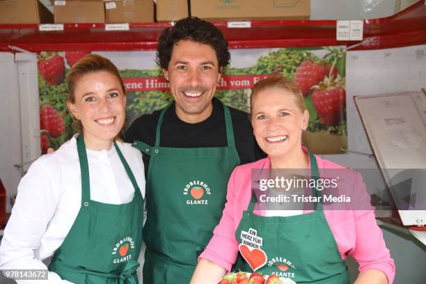 Janne Meyer-Zimmermann, Boris Entrup and Cornelia Poletto during the charity sale of strawberries and raspberries of Erdbeerhof Glantz for 'Ein Herz...