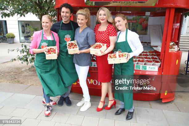 Cornelia Poletto, Janne Meyer-Zimmermann, Boris Entrup, Sandra Quadflieg and Susanne Steinkraus during the charity sale of strawberries and...