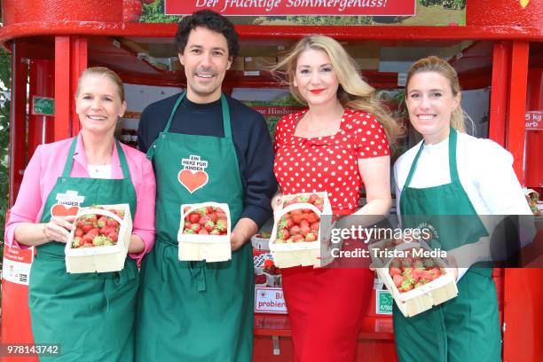 Cornelia Poletto, Janne Meyer-Zimmermann, Boris Entrup and Sandra Quadflieg during the charity sale of strawberries and raspberries of Erdbeerhof...