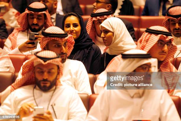 Saudi moviegoers wait for the film to begin at the AMC Entertainment cinema theatre of the King Abdullah Financial District in Riyadh, Saudi Arabia,...
