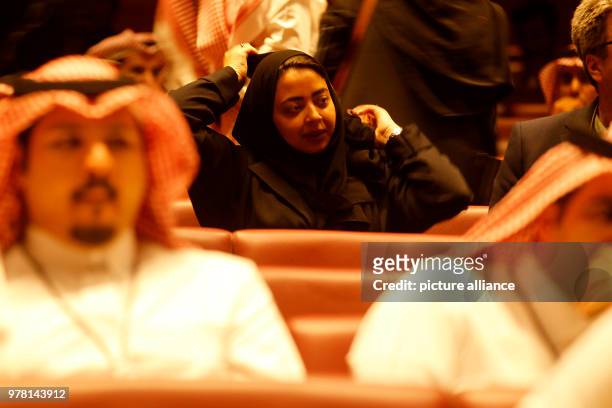 Dpatop - Saudi moviegoers wait for the film to begin at the AMC Entertainment cinema theatre of the King Abdullah Financial District in Riyadh, Saudi...