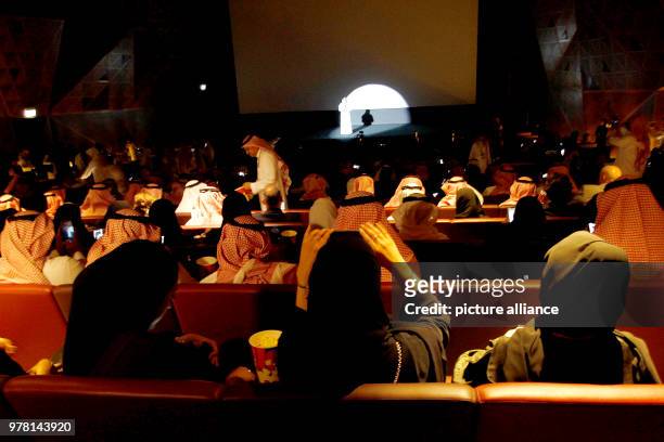 Dpatop - Saudi moviegoers wait for the film to begin at the AMC Entertainment cinema theatre of the King Abdullah Financial District in Riyadh, Saudi...