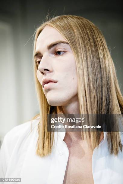 Model is seen backstage ahead of the Sartorial Monk show during Milan Men's Fashion Week Spring/Summer 2019 on June 18, 2018 in Milan, Italy.