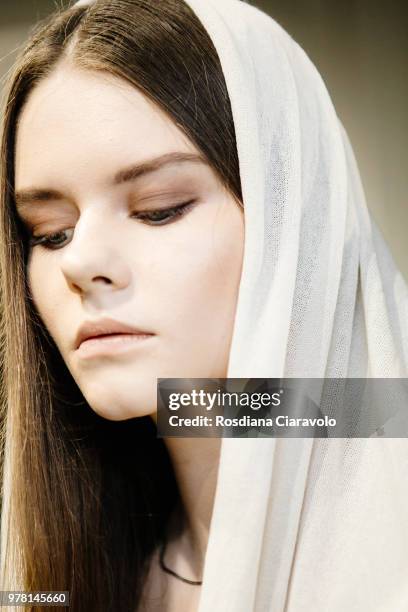 Model is seen backstage ahead of the Sartorial Monk show during Milan Men's Fashion Week Spring/Summer 2019 on June 18, 2018 in Milan, Italy.