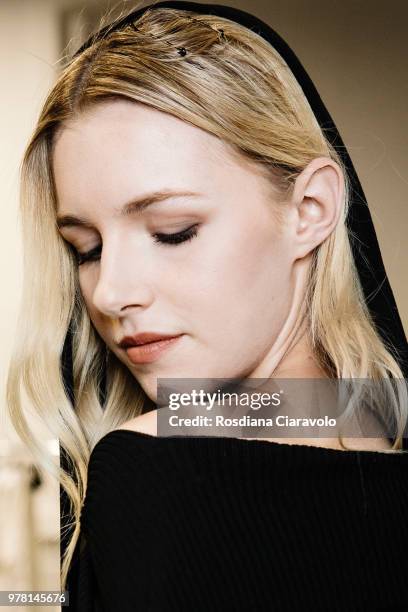 Model is seen backstage ahead of the Sartorial Monk show during Milan Men's Fashion Week Spring/Summer 2019 on June 18, 2018 in Milan, Italy.