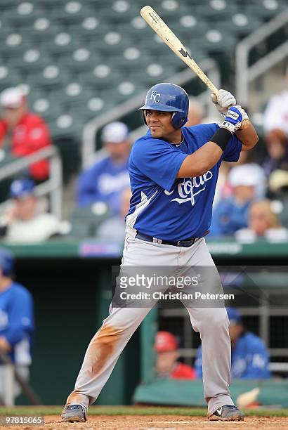 Brayan Pena of the Kansas City Royals bats against the Cincinnati Reds during the MLB spring training game at Goodyear Ballpark on March 8, 2010 in...