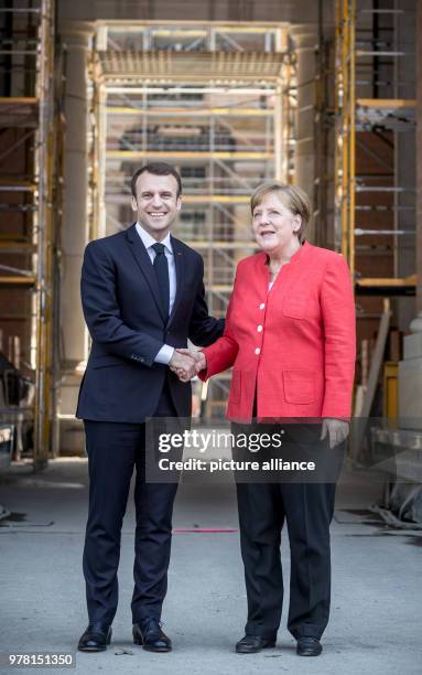 Dpatop - German Chancellor Angela Merkel receives French President Emmanuel Macron at the Berlin Palace for a meeting, in Berlin, Germany, 19 April...