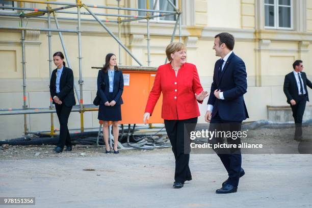 German Chancellor Angela Merkel receives French President Emmanuel Macron at the Berlin Palace for a meeting, in Berlin, Germany, 19 April 2018. Both...