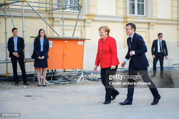 German Chancellor Angela Merkel receives French President Emmanuel Macron at the Berlin Palace for a meeting, in Berlin, Germany, 19 April 2018. Both...