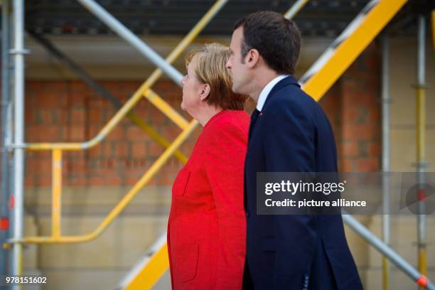 Dpatop - German Chancellor Angela Merkel receives French President Emmanuel Macron at the Humboldt Forum in the Berlin Palace, in Berlin, Germany, 19...