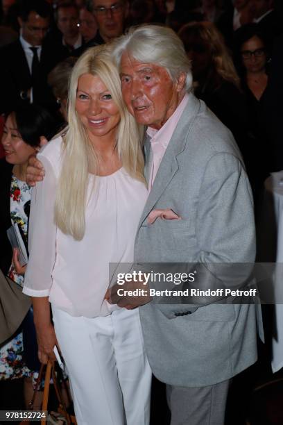 Nadine Rodd and Auctioneer of the event, Maitre Pierre Cornette de Saint Cyr attend the "Vendanges Solidaires Barriere" : Auction at Fouquet's...