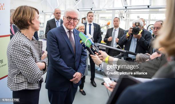 April 2018, Germany, Bietigheim-Bissingen: German President Frank-Walter Steinmeier and his wife Elke Buedenbender give a press conference during a...