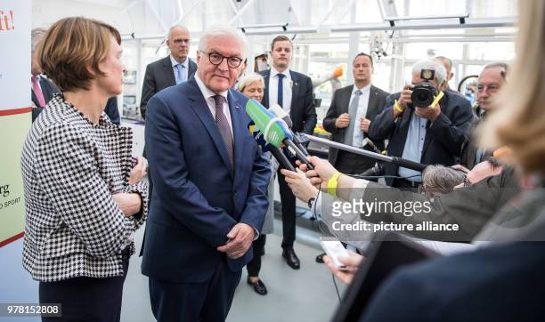 German President Frank-Walter Steinmeier and wife Elke Buedenbender speak during a press conference while on a visit to the Lernfabrik 4.0 at the...