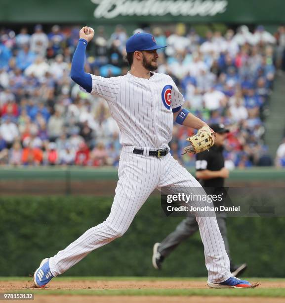 Kris Bryant of the Chicago Cubs throws to first base against the Pittsburgh Pirates at Wrigley Field on June 8, 2018 in Chicago, Illinois. The Cubs...