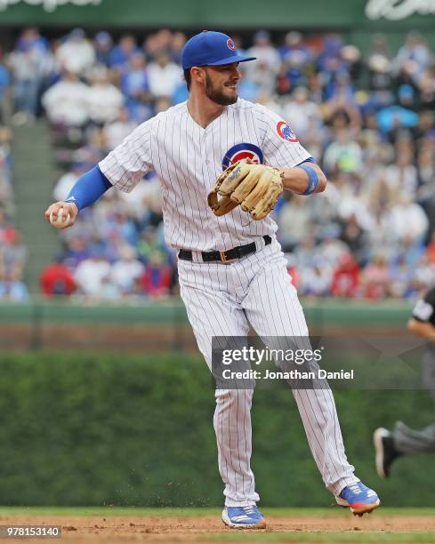 Kris Bryant of the Chicago Cubs throws to first base against the Pittsburgh Pirates at Wrigley Field on June 8, 2018 in Chicago, Illinois. The Cubs...