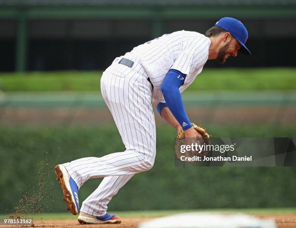 Kris Bryant of the Chicago Cubs fields the ball against the Pittsburgh Pirates at Wrigley Field on June 8, 2018 in Chicago, Illinois. The Cubs...