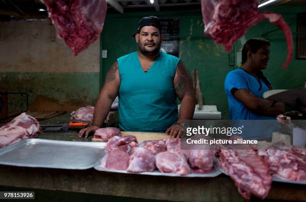 Dpatop - A butcher waiting for customers at a market in Havana, Cuba, 19 April 2018. The Cuban parliament has elected Raul Castro's deputy Miguel...