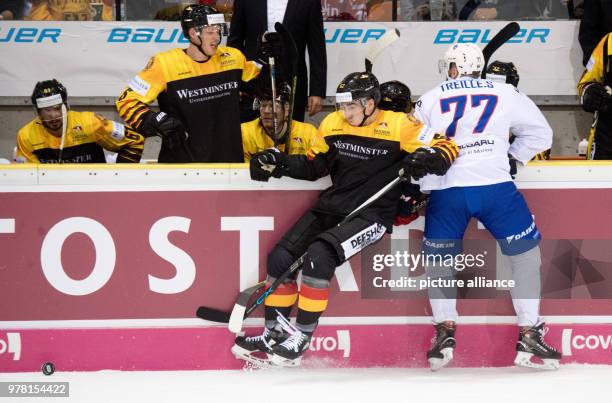 April 2018, Wolfsburg, Germany: Ice hockey, Germany vs France, Eis Arena: Germany's Simon Danner and France's Sacha Treille vie for the puck. Photo:...