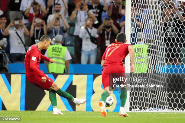 Cristiano Ronaldo of Portugal converts the penalty kick to score the opening goal during the 2018 FIFA World Cup Russia group B match between...