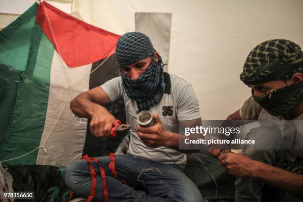 Palestinian protesters prepare kites with home made firebombs during clashes along the Israel-Gaza border, east of Gaza City, Gaza Strip, 20 April...