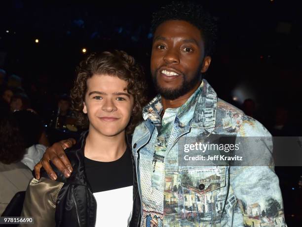 Actors Gaten Matarazzo and Chadwick Boseman attend the 2018 MTV Movie And TV Awards at Barker Hangar on June 16, 2018 in Santa Monica, California.