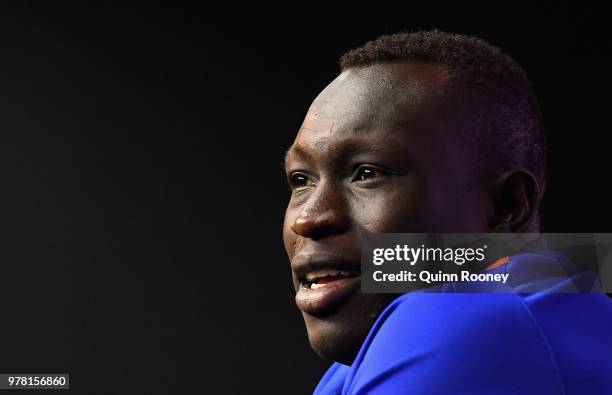 Majak Daw of the Kangaroos speaks to the media during an AFL press conference at Etihad Stadium on June 19, 2018 in Melbourne, Australia.