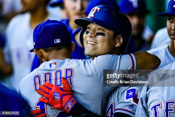 Shin-Soo Choo of the Texas Rangers celebrates hitting a home run with Rougned Odor during the first inning against the Kansas City Royals at Kauffman...