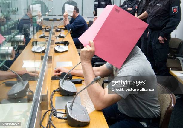 April 2018, Germany, Celle: Suspected Al-Nusra Front members sit in court, awaiting their trial. Three Syrian brothers who came to Germany as...