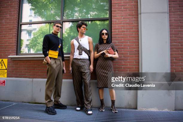 Guido Milani, in Fendi total look, Marc Forne, in Fendi total look and Niki Wujie, in Fendi total look, are seen in the streets of Milan before the...
