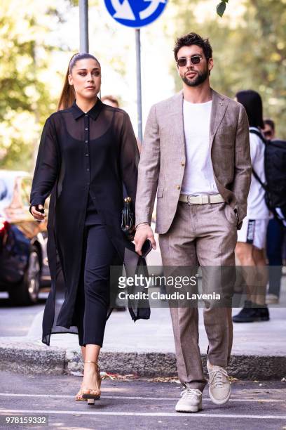 Ludovica Frasca, wearing black long shirt, black pants and Sergio Rossi gold heels and Ivano Marino, wearing brown suit and white t shirt, are seen...