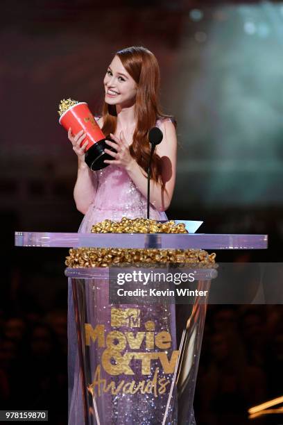 Actor Madelaine Petsch accepts the Scene Stealer award for 'Riverdale' onstage during the 2018 MTV Movie And TV Awards at Barker Hangar on June 16,...